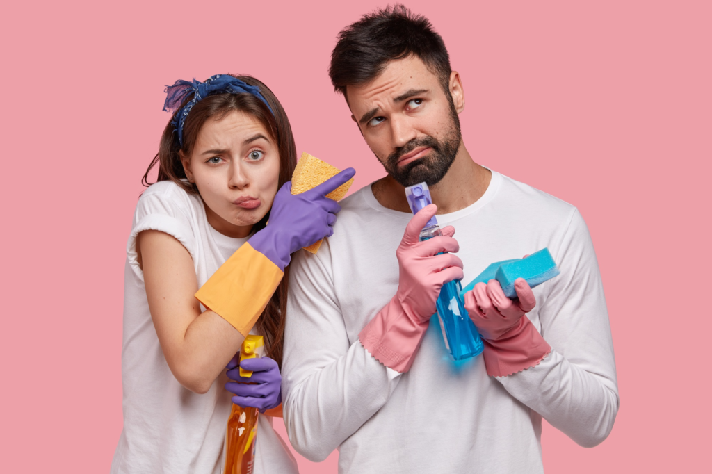 Covert narcissist housework struggle - couple with cleaning supplies showing relationship tension over chores